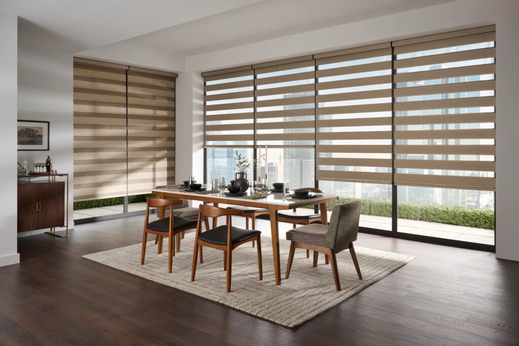 Beige zebra blinds installed on large condo windows in an Ontario dining room