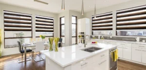 Modern kitchen and dining area with zebra blinds on multiple windows in an Ontario home.